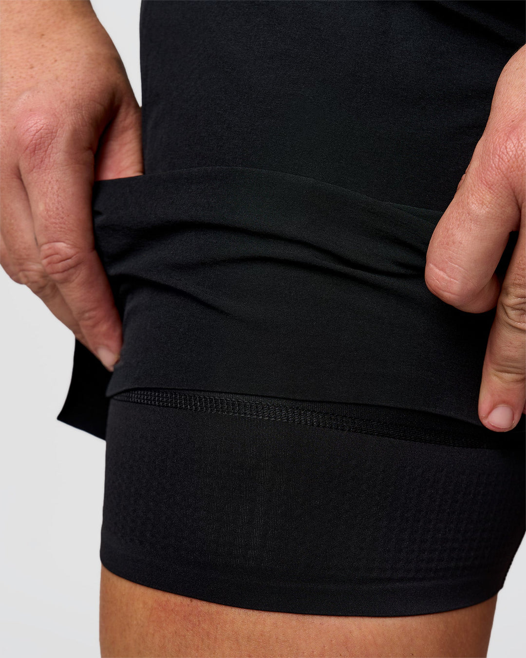 Man wearing Hybrid Lined 5" Short - Black-Reflective | Model:Jaiden | Size:L - view 4