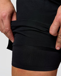 Man wearing Hybrid Lined 5" Short - Black-Reflective | Model:Jaiden | Size:L | Thumbnail Index: 3