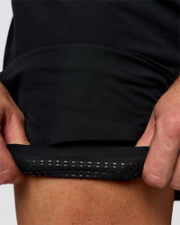 Man wearing Hybrid Lined 5" Short - Black-Reflective | Model:Jaiden | Size:L | Thumbnail Index: 7