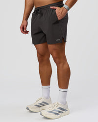 Man wearing Pace 5" Lined Running Short - Black-Onyx | Model:Jaiden | Size:L | Thumbnail Index: 10