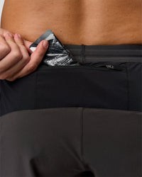 Man wearing Pace 5" Lined Running Short - Black-Onyx | Model:Jaiden | Size:L | Thumbnail Index: 12