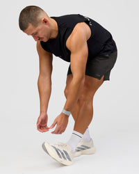 Man wearing Pace 5" Lined Running Short - Black-Onyx | Model:Jaiden | Size:L | Thumbnail Index: 14