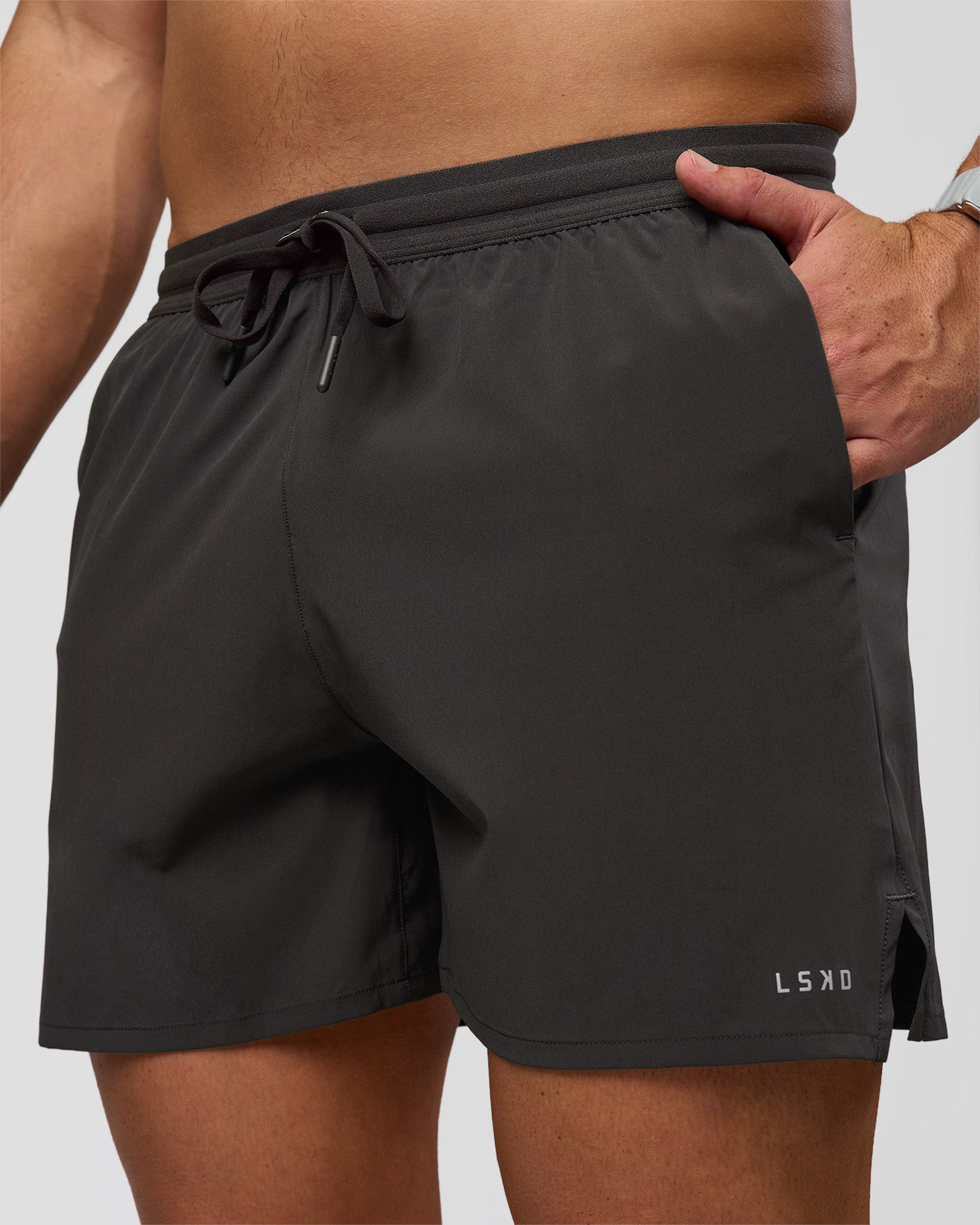 Man wearing Pace 5" Lined Running Short - Black-Onyx | Model:Jaiden | Size:L