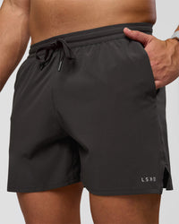 Man wearing Pace 5" Lined Running Short - Black-Onyx | Model:Jaiden | Size:L | Thumbnail Index: 0