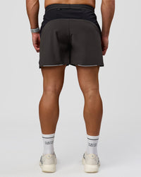 Man wearing Pace 5" Lined Running Short - Black-Onyx | Model:Jaiden | Size:L | Thumbnail Index: 1