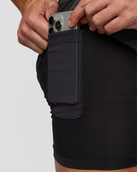 Man wearing Pace 5" Lined Running Short - Black-Onyx | Model:Jaiden | Size:L | Thumbnail Index: 2
