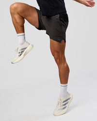 Man wearing Pace 5" Lined Running Short - Black-Onyx | Model:Jaiden | Size:L | Thumbnail Index: 3