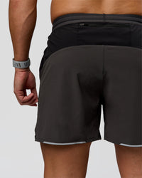 Man wearing Pace 5" Lined Running Short - Black-Onyx | Model:Jaiden | Size:L | Thumbnail Index: 4