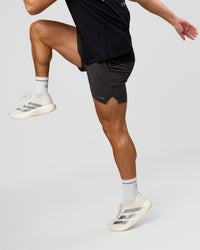 Man wearing Pace 5" Lined Running Short - Black-Onyx | Model:Jaiden | Size:L | Thumbnail Index: 5