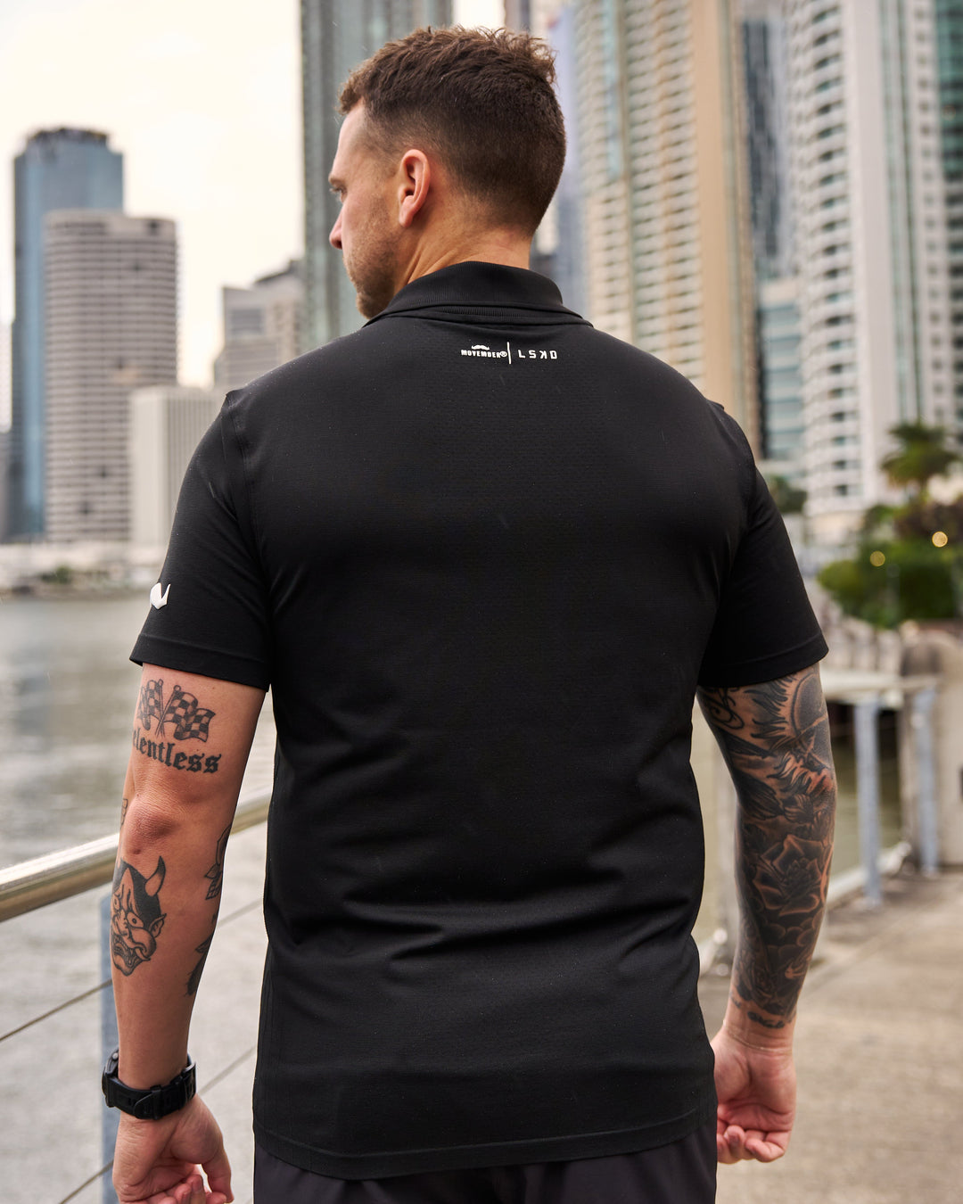 Man wearing Movember x LSKD Drive Seamless Polo - Black | Model:Macca | Size:L - view 5