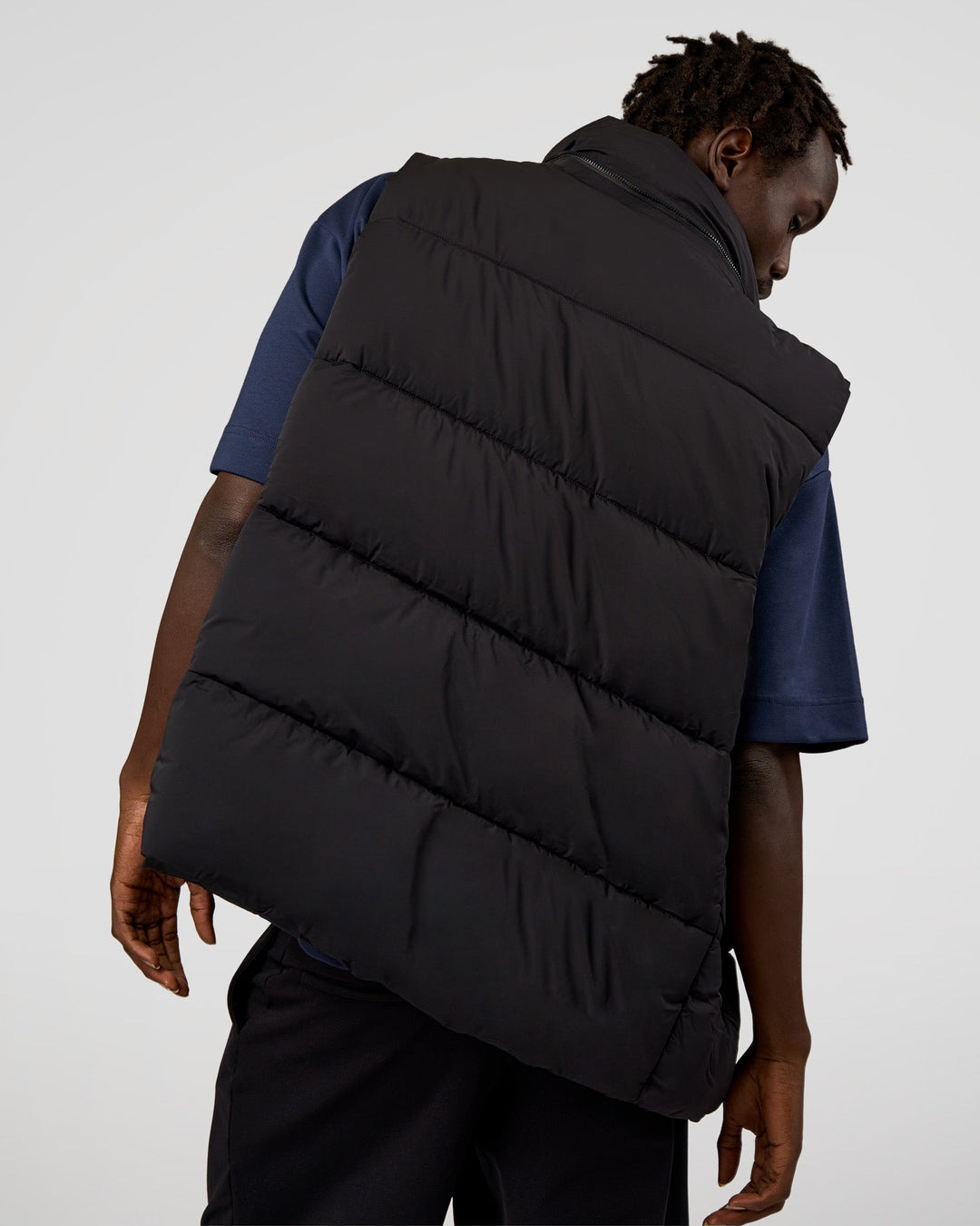 Man wearing Base Puffer Vest - Black | Model:Okello | Size:L - view 3