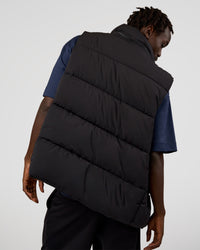 Man wearing Base Puffer Vest - Black | Model:Okello | Size:L | Thumbnail Index: 2