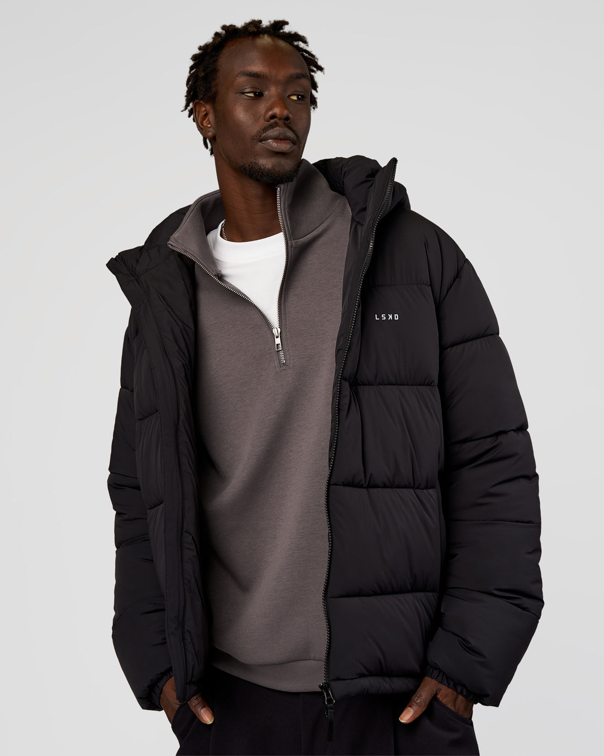Man wearing Base Puffer Jacket - Black | Model:Okello | Size:L - view 2