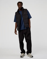 Man wearing Base Puffer Vest - Black | Model:Okello | Size:L | Thumbnail Index: 1