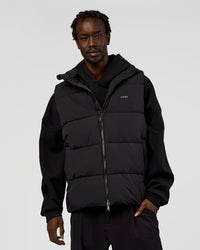 Man wearing Base Puffer Vest - Black | Model:Okello | Size:L | Thumbnail Index: 0