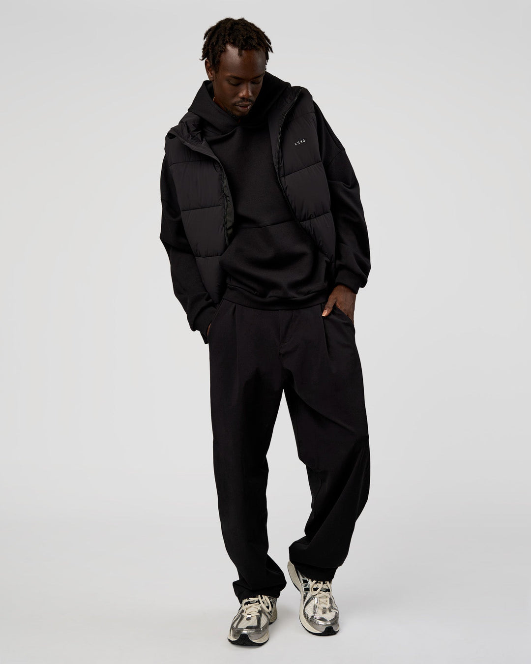 Man wearing Base Puffer Vest - Black | Model:Okello | Size:L - view 4