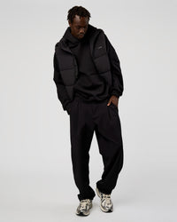Man wearing Base Puffer Vest - Black | Model:Okello | Size:L | Thumbnail Index: 3