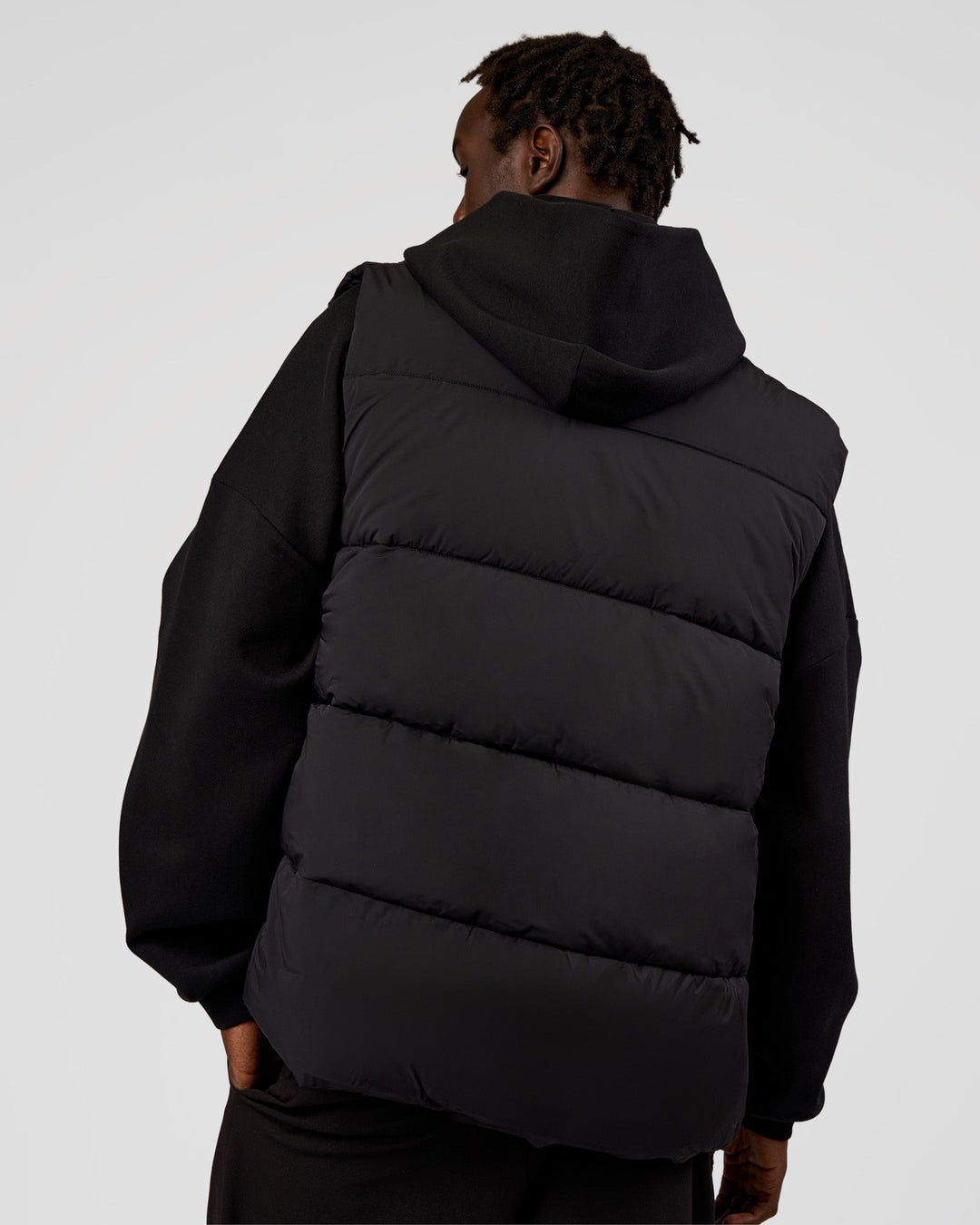 Man wearing Base Puffer Vest - Black | Model:Okello | Size:L - view 5