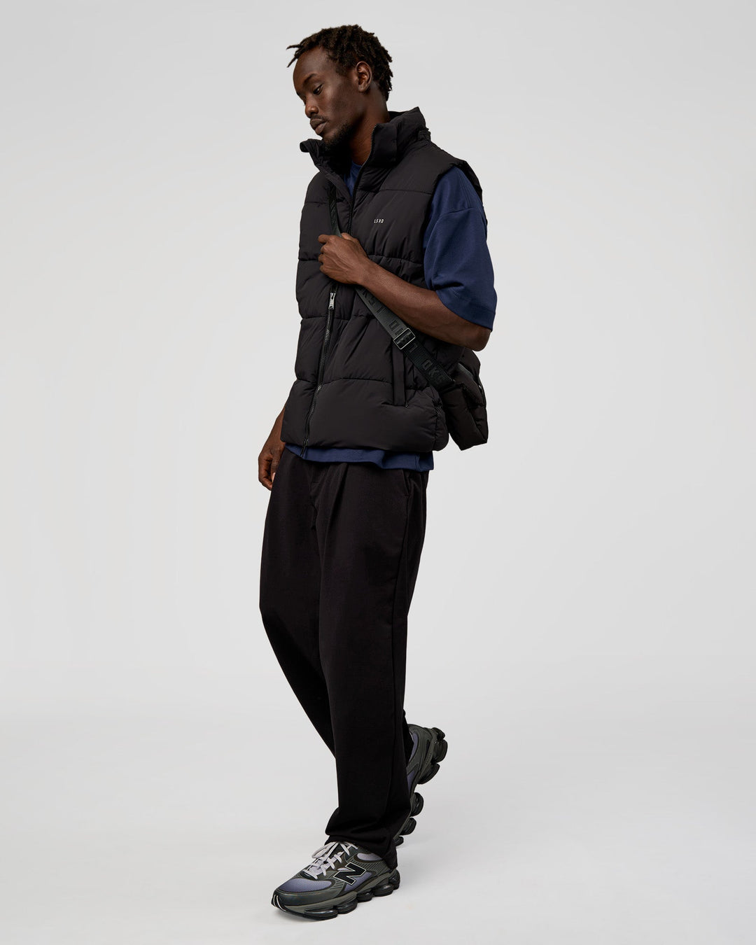 Man wearing Base Puffer Vest - Black | Model:Okello | Size:L - view 7