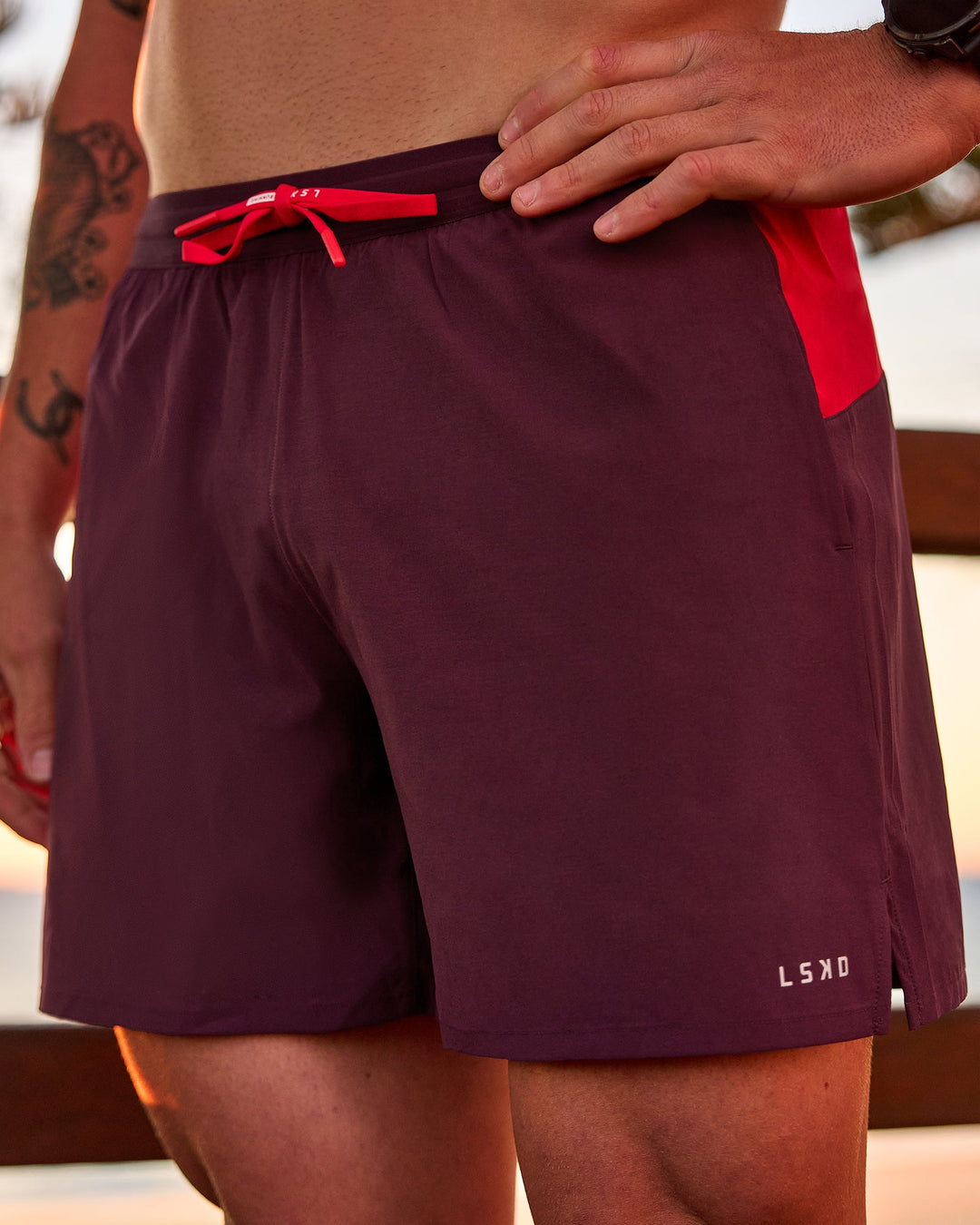 Man wearing Pace 5" Lined Running Short - Cherry Lacquer-Scarlet | Model:Riley | Size:L - view 1