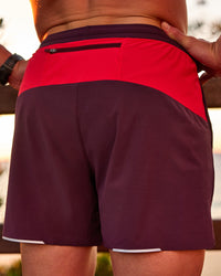 Man wearing Pace 5" Lined Running Short - Cherry Lacquer-Scarlet | Model:Riley | Size:L | Thumbnail Index: 2