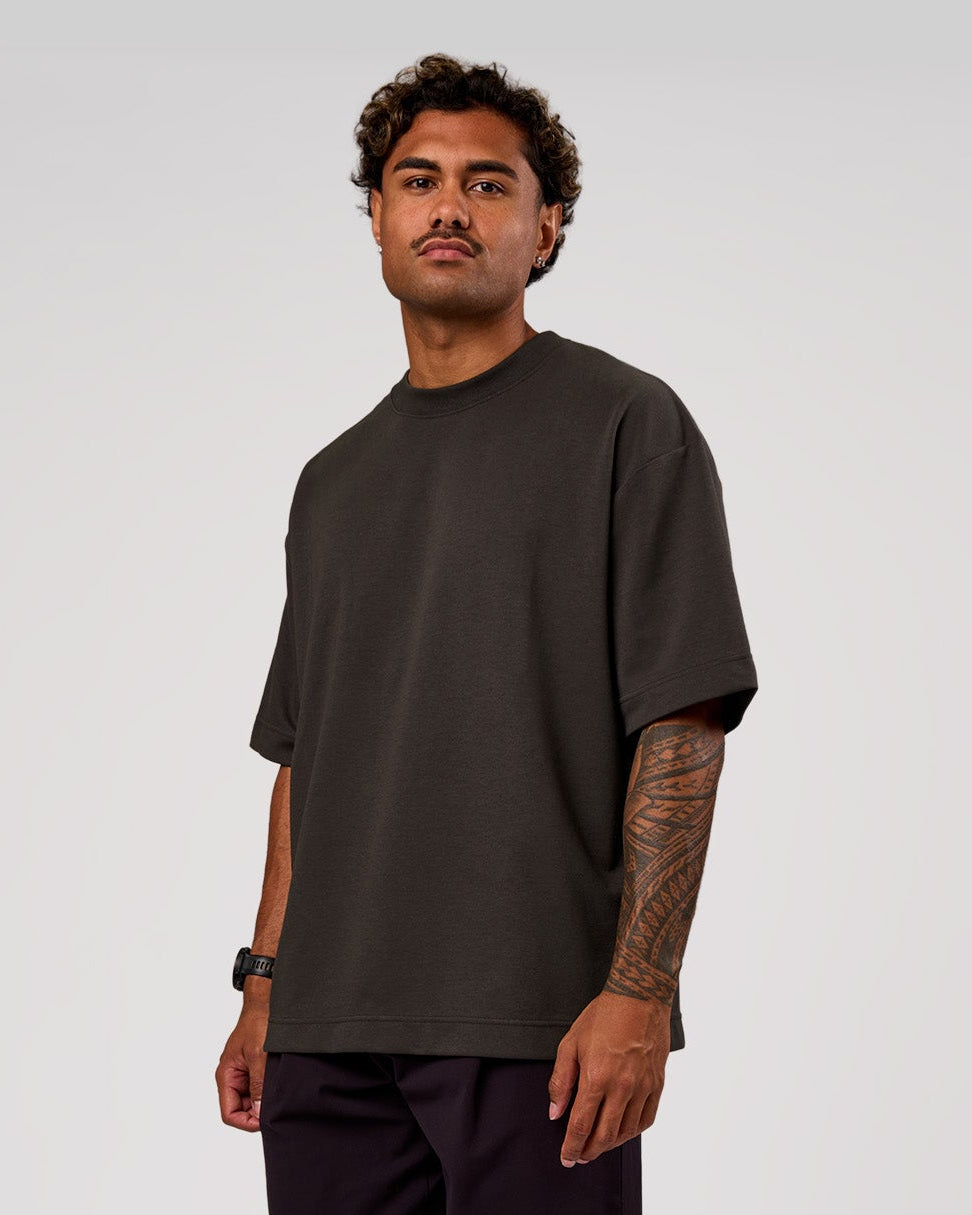 Man wearing AfterDark ZeroCrease Oversized Tee - Onyx | Model:Xav | Size:L - view 1