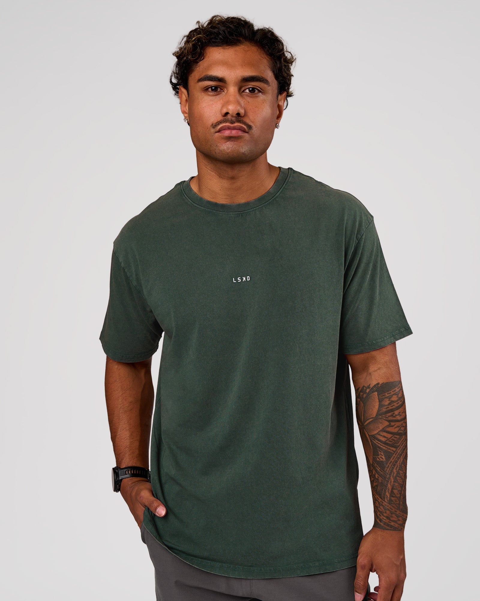 Man wearing Base FLXCotton Tee Oversized - Midnight Green Washed | Model:Xav | Size:L