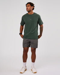 Man wearing Base FLXCotton Tee Oversized - Midnight Green Washed | Model:Xav | Size:L | Thumbnail Index: 3