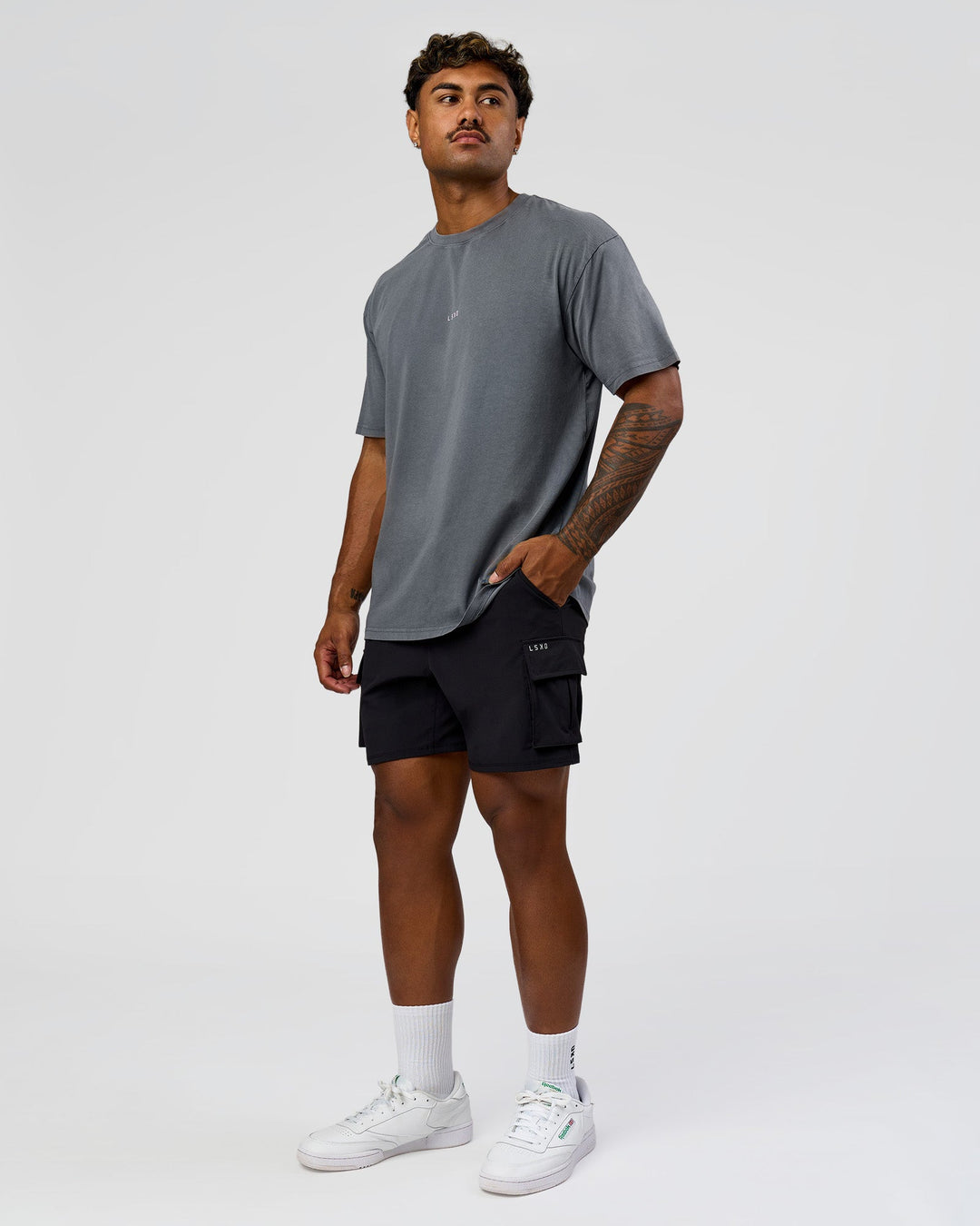 Man wearing Built On Values FLXCotton Oversized Tee - Dark Storm Washed-Pink Rose | Model:Xav | Size:L