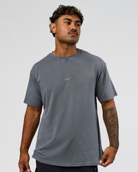 Man wearing Built On Values FLXCotton Oversized Tee - Dark Storm Washed-Pink Rose | Model:Xav | Size:L