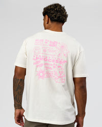 Man wearing Built On Values FLXCotton Oversized Tee - Off White-Pink Rose | Model:Xav | Size:L