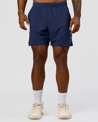 Man wearing Greatest of All Time Functional Training 7" Short - Future Navy-White | Model:Xav | Size:L | Thumbnail Index: 1