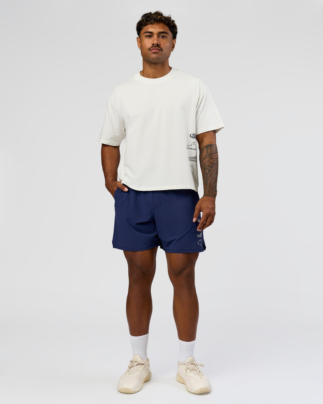 Man wearing Greatest of All Time Functional Training 7" Short - Future Navy-White | Model:Xav | Size:L - view 11