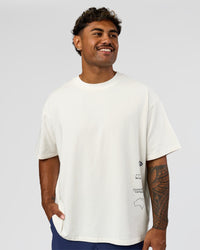 Man wearing Greatest of All Time Heavyweight FLXCotton Oversized Tee - Off White Washed-Scarlet | Model:Xav | Size:L | Thumbnail Index: 13