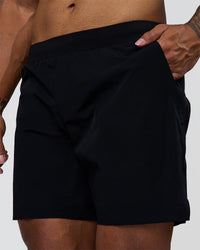 Man wearing Hybrid Lined 7" Short - Black | Model:Xav | Size:L | Thumbnail Index: 0