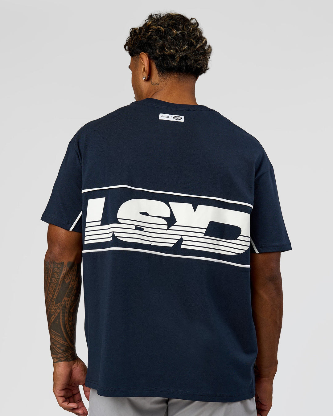 Man wearing Inline Heavyweight FLXCotton Oversized Tee - Midnight Navy-White | Model:Xav | Size:L - view 2