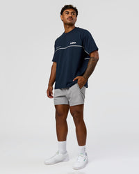 Man wearing Inline Heavyweight FLXCotton Oversized Tee - Midnight Navy-White | Model:Xav | Size:L | Thumbnail Index: 13