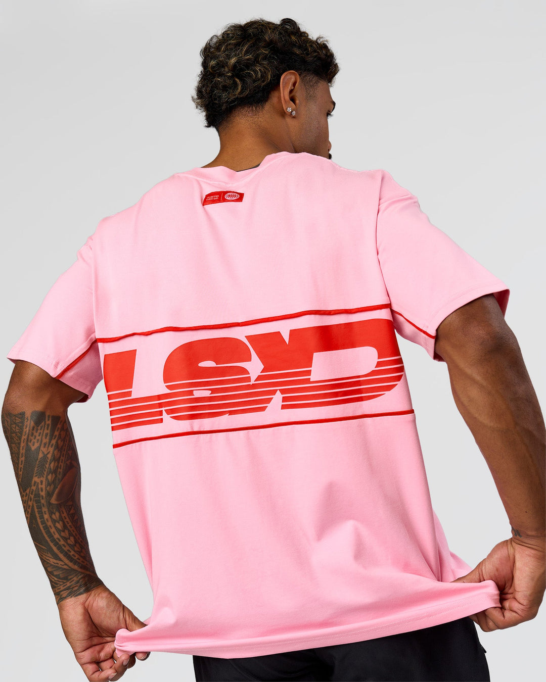Man wearing Inline Heavyweight FLXCotton Oversized Tee - Pink Rose-Flame | Model:Xav | Size:L - view 14