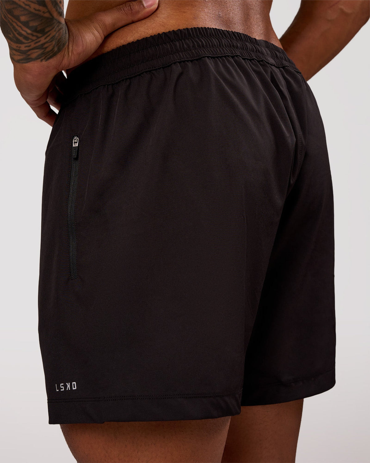 Man wearing Rep 5" Performance Short - Black | Model:Xav | Size:L
