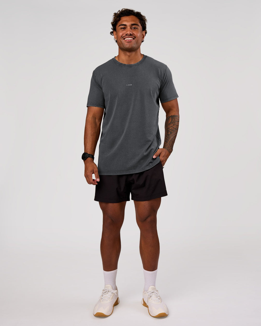 Man wearing Rep 5" Performance Short - Black | Model:Xav | Size:L - view 3