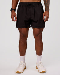 Man wearing Rep 5" Performance Short - Black | Model:Xav | Size:L | Thumbnail Index: 5