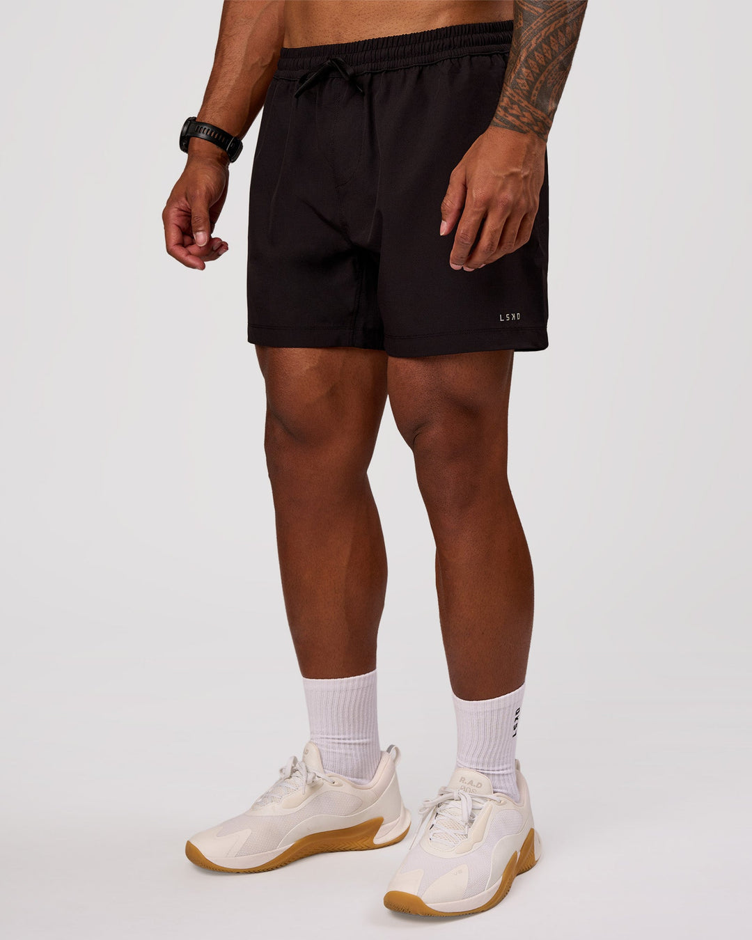 Man wearing Rep 5" Performance Short - Black | Model:Xav | Size:L - view 7