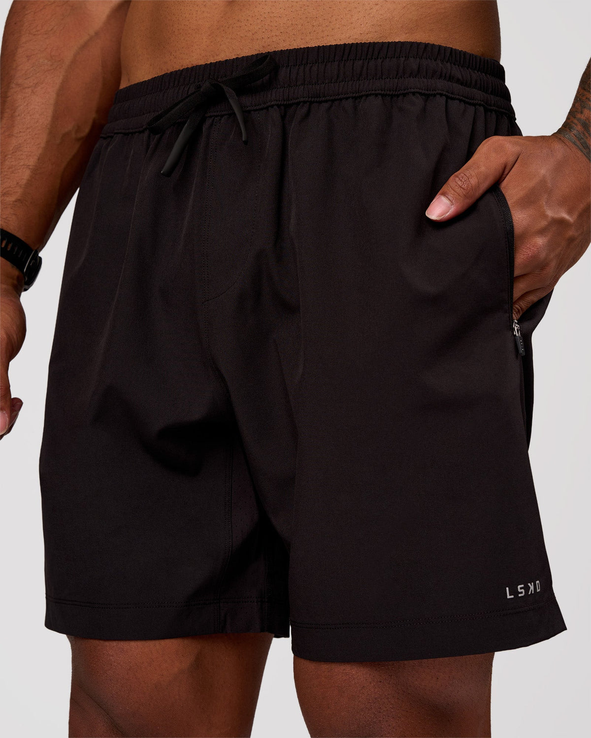 Man wearing Rep 7" Performance Short - Black-White | Model:Xav | Size:L