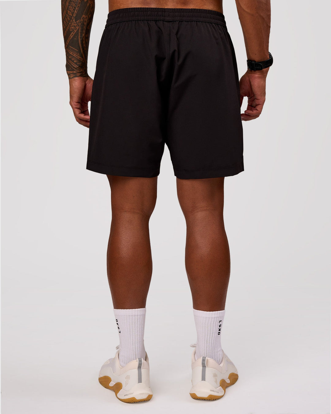 Man wearing Rep 7" Performance Short - Black-White | Model:Xav | Size:L - view 6