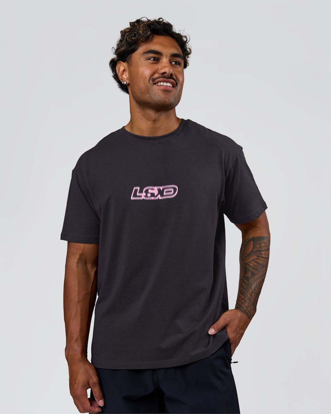 Man wearing SoCal 26 FLXCotton Oversize Tee  - Onyx-Pink Rose | Model:Xav | Size:L - view 14