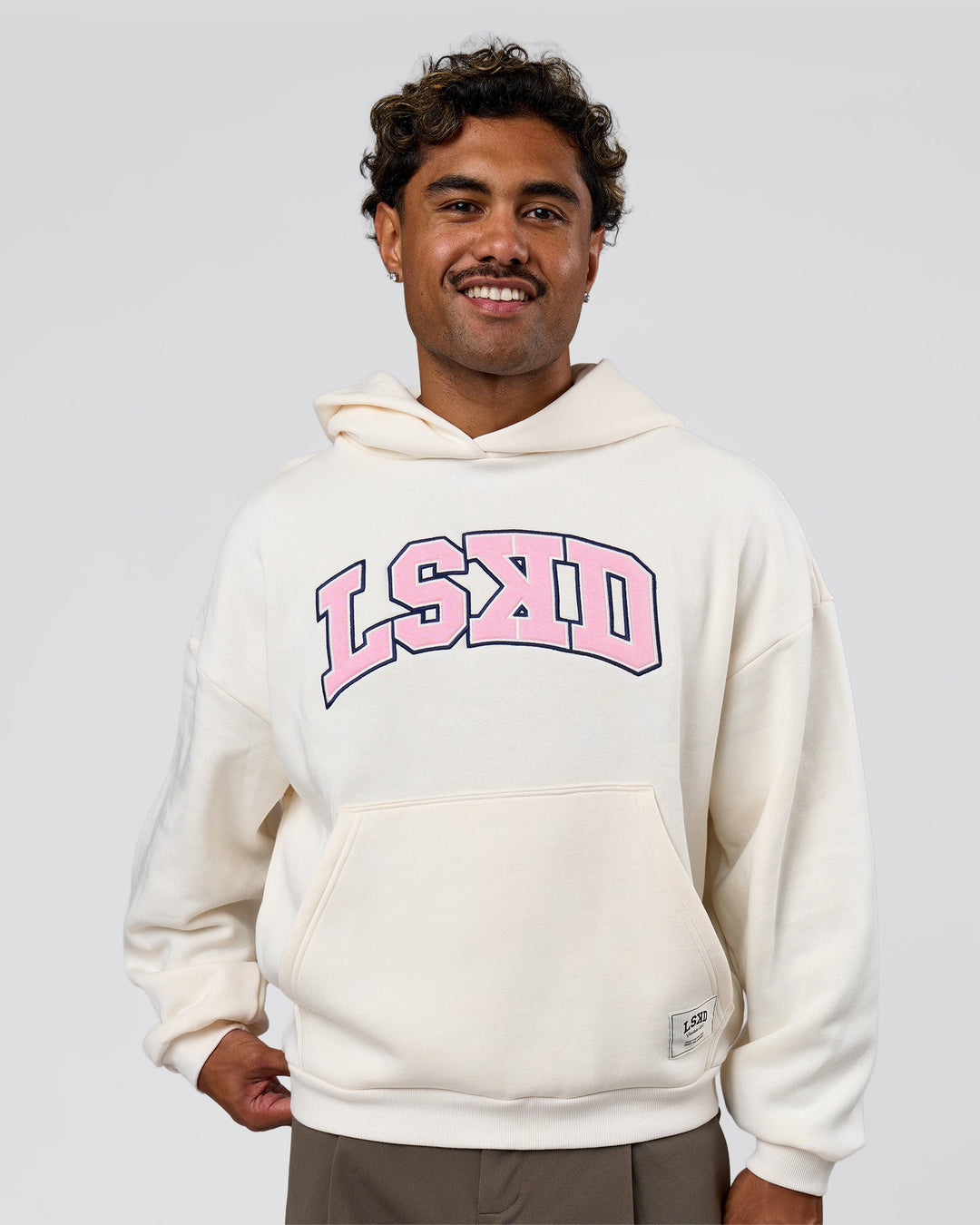 Man wearing Varsity Boxy Hoodie - Off White-Pink Rose | Model:Xav | Size:L - view 4
