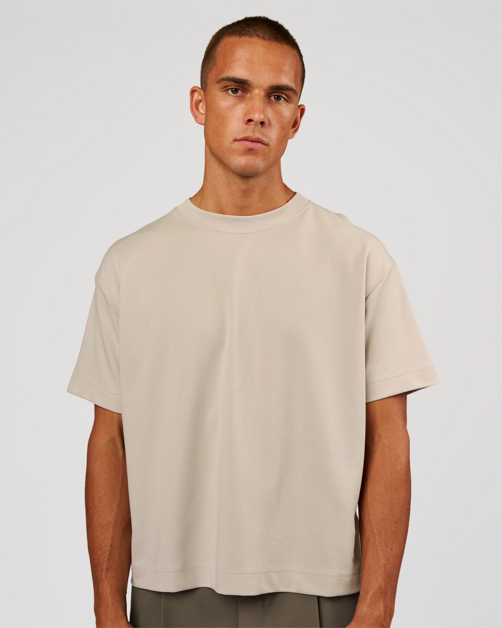 Man wearing AfterDark ZeroCrease Boxy Tee - Shale Beige | Model:Albert | Size:M