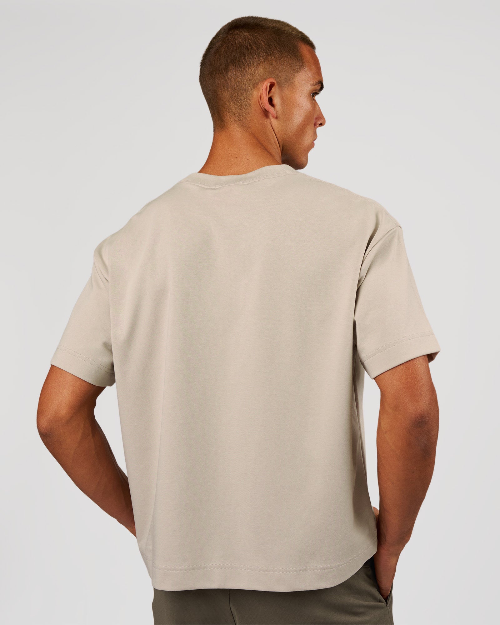 Man wearing AfterDark ZeroCrease Boxy Tee - Shale Beige | Model:Albert | Size:M
