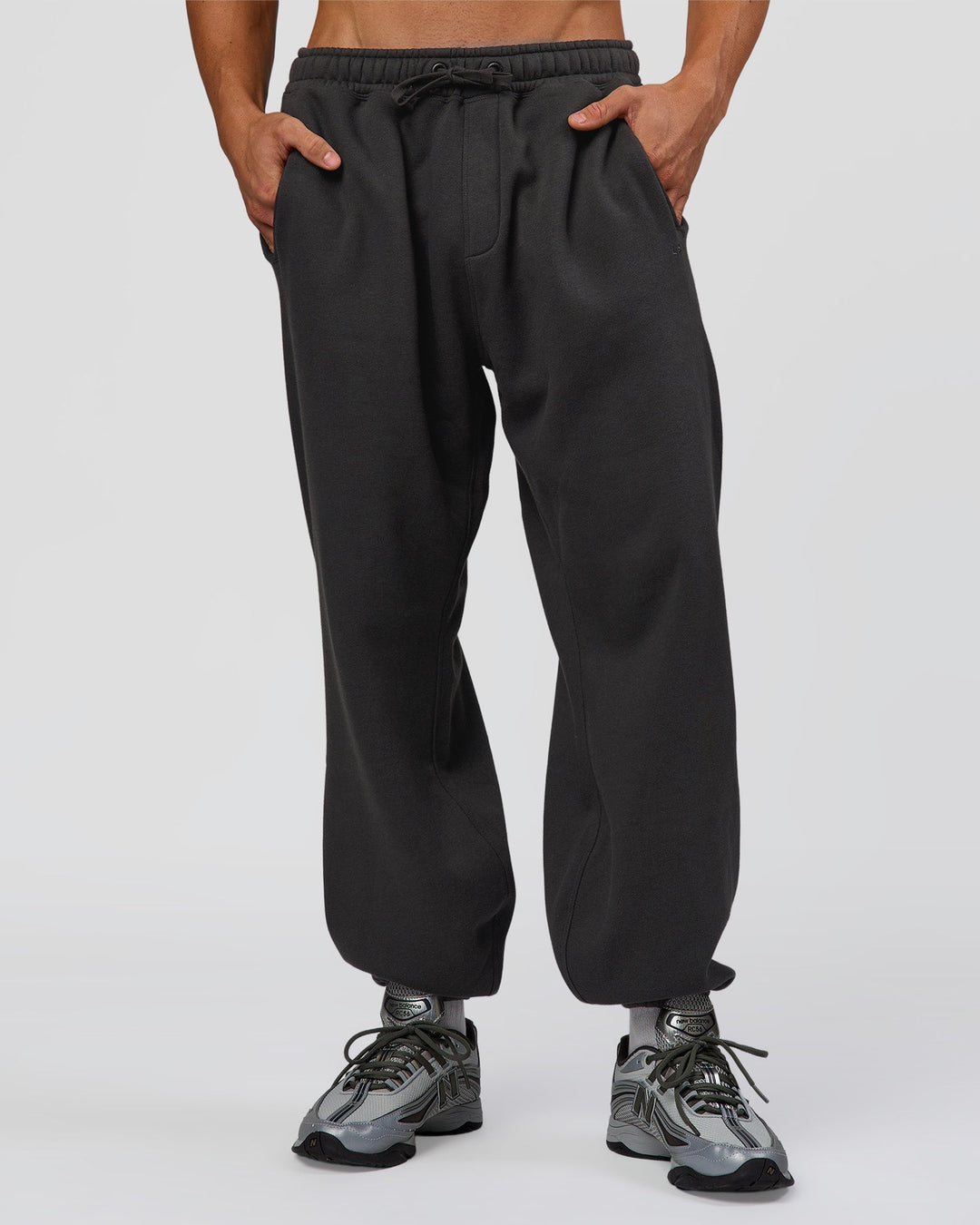 Man wearing Base Baggy Cuffed Track Pant - Onyx | Model:Albert | Size:M - view 2