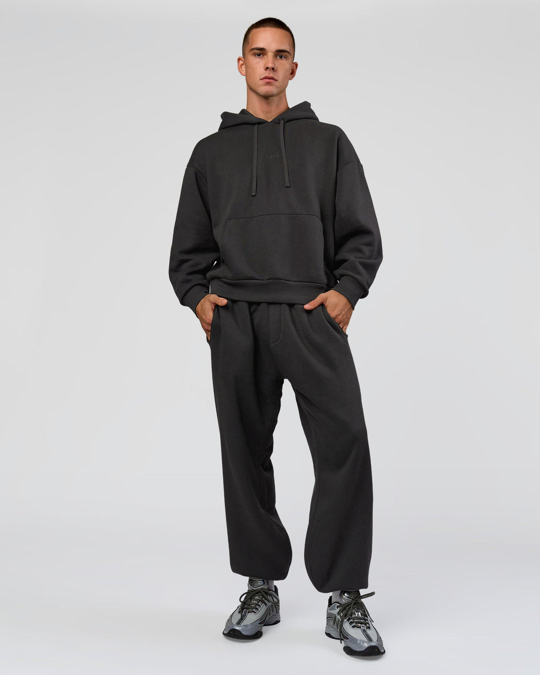 Man wearing Base Baggy Cuffed Track Pant - Onyx | Model:Albert | Size:M - view 3